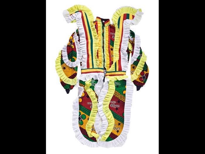 Tailored jacket with zip fastening, in red, green, yellow, black and white fabric with shoulder decoration and four tail features, extending from the waistband, part of an Ugly Man fancy dress masquerade costume, purchased from a tailor in Winneba by D.A. Acquandoh (Hippies): Africa, West Africa, Ghana, Elmina, collected in 2000 - 2001 