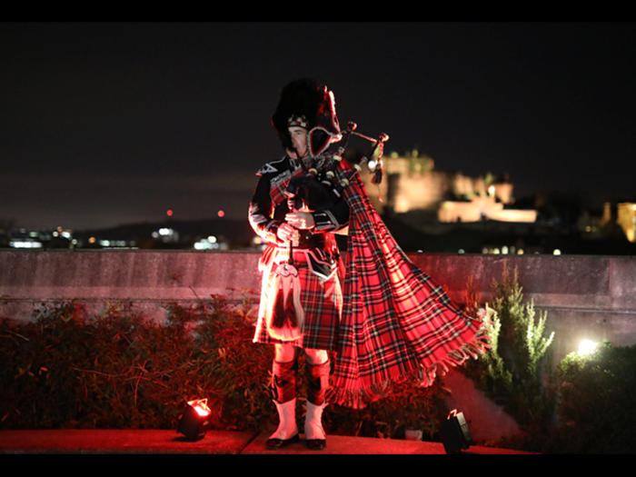 A piper on the National Museum of Scotland's Roof Terrace.