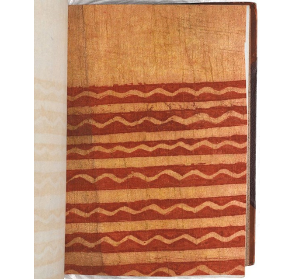 Rectagular cut of light brown barkcloth with a red wavy pattern