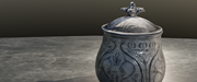 Digital scan of the Galloway Hoard silver vessel in full with lid on, placed on a marble table