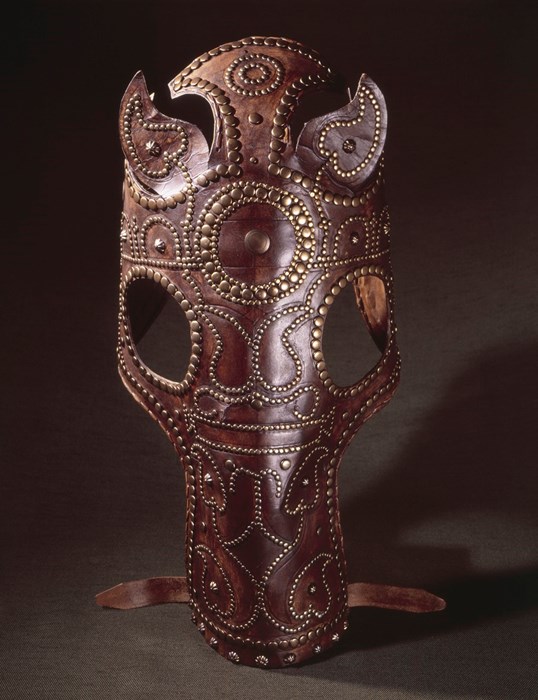Replica chamfron, red-brown in colour with elaborate bronze stud patterns, distinctive eye holes and ear flaps