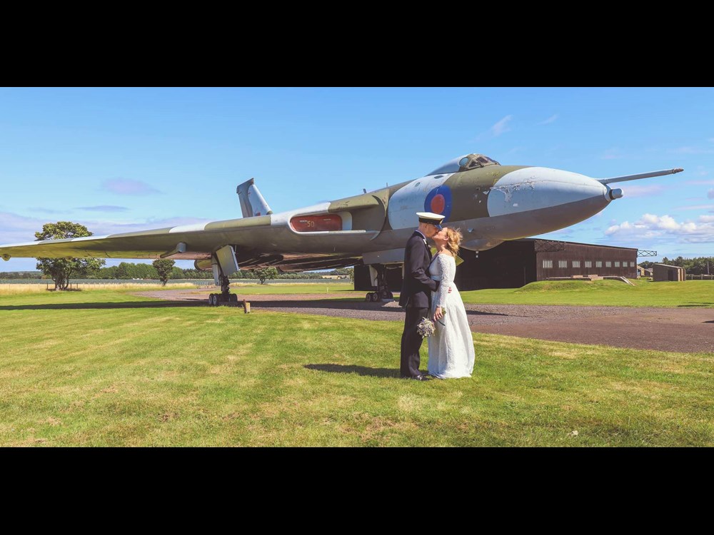 A wedding under the Vulcan at the National Museum of Flight.