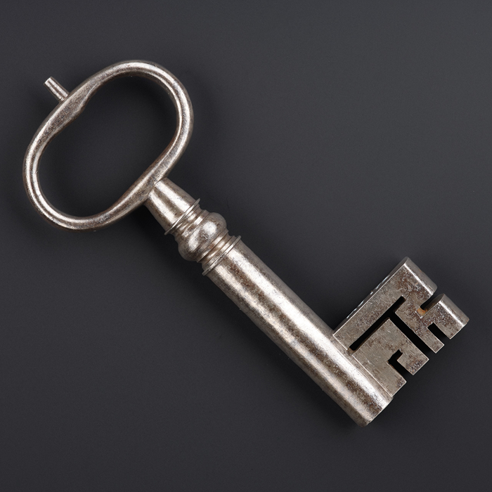 A large grey key.