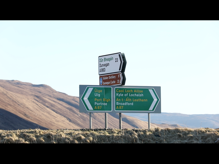 Bilingual Gaelic-English road sign from Sligachan, Isle of Skye, 2018. X.2018. Contemporary collecting provides a way of exploring and documenting the impact of changing laws and policies, as well as shifting attitudes, on communities across Scotland. Today, all of the signs on trunk roads across the North-West region of Scotland carry a place name in Gaelic first with English underneath. 