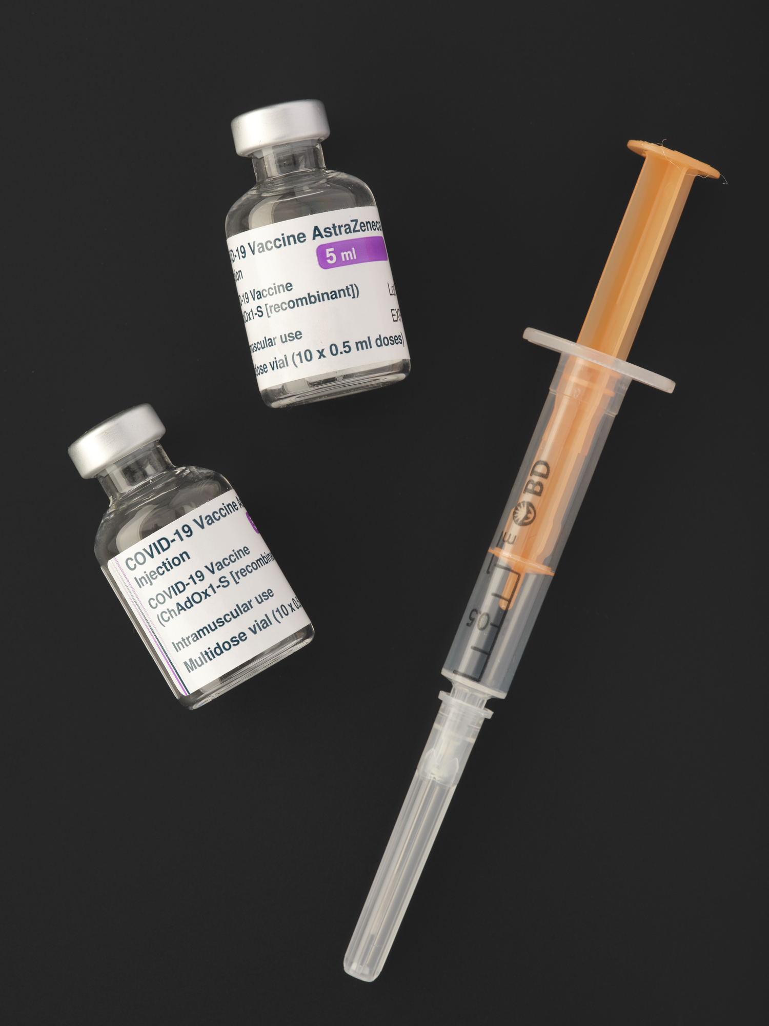 COVID-19 AstraZeneca vaccine and syringe for vaccination .T.2021.12. The AstraZeneca COVID-19 vaccine was developed by the University of Oxford and the pharmaceutical company, AstraZeneca. The vaccine was developed by building on existing research into a vaccine for MERS was approved for use in the UK on 30 December 2020. Now over 2 billion doses of the vaccine have been administered across the globe. 