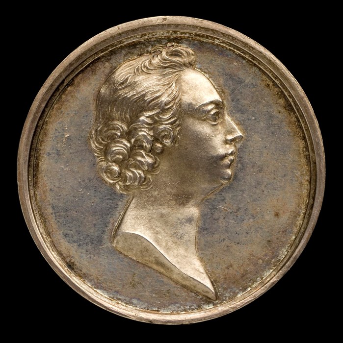 A medal with a depiction of Bonnie Prince Charlie.