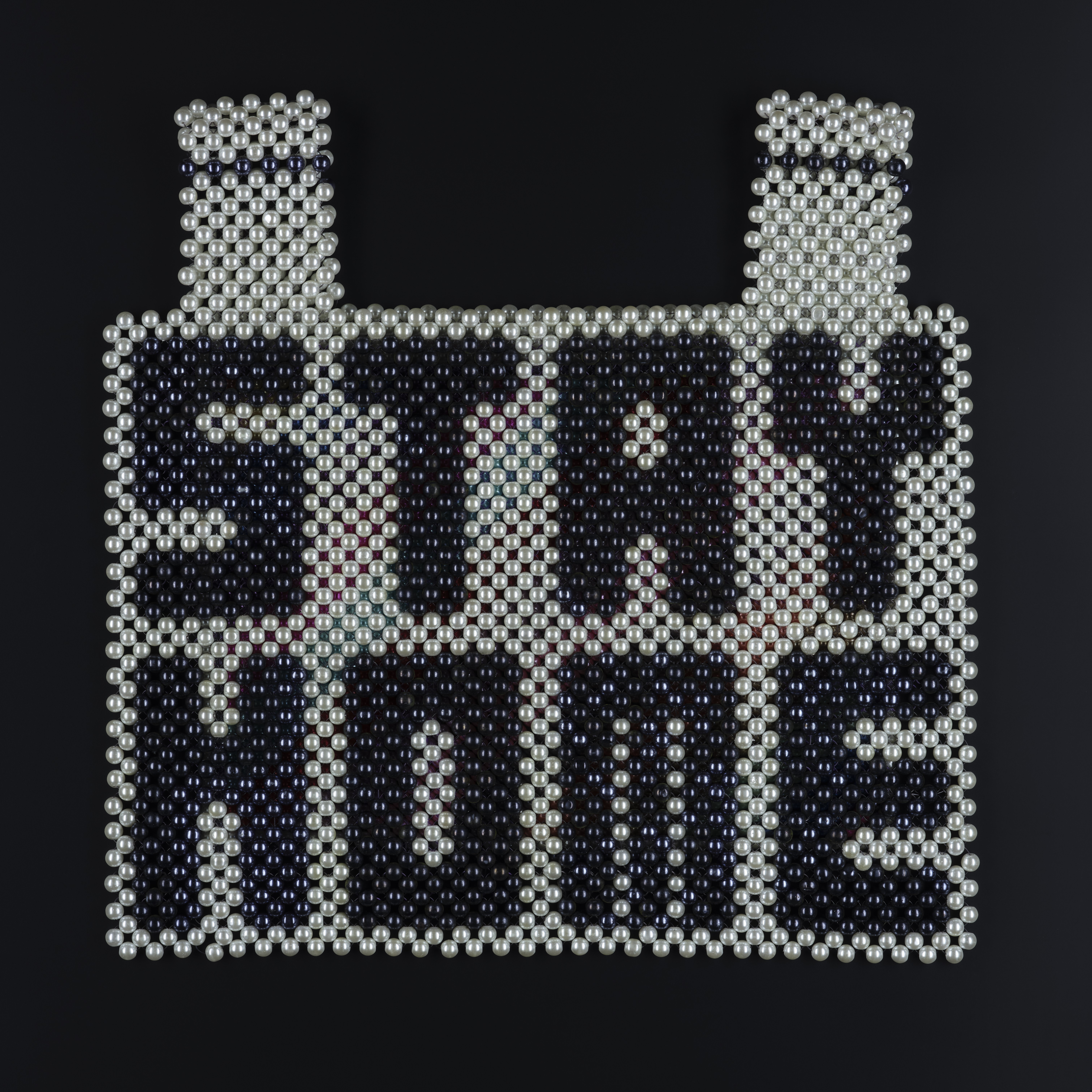 ‘Stay Home!’, breastplate and backpiece, by Sera Park Choi, Rhode Island, USA (2020). K.2021.5. Created at the start of 2020, when the world shut down, ‘Stay Home!’ a protective beaded vest by Sera Park Choi, resonates with the global situation at the time, and the order from governments around the world to ʻStay Home’. Her work also draws attention to the societal racism which continues to be levelled at Asian communities.
