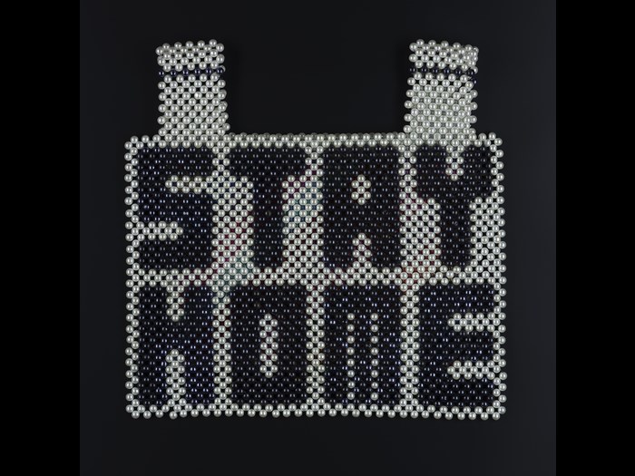 ‘Stay Home!’, breastplate and backpiece, by Sera Park Choi, Rhode Island, USA (2020). K.2021.5. Created at the start of 2020, when the world shut down, ‘Stay Home!’ a protective beaded vest by Sera Park Choi, resonates with the global situation at the time, and the order from governments around the world to ʻStay Home’. Her work also draws attention to the societal racism which continues to be levelled at Asian communities.