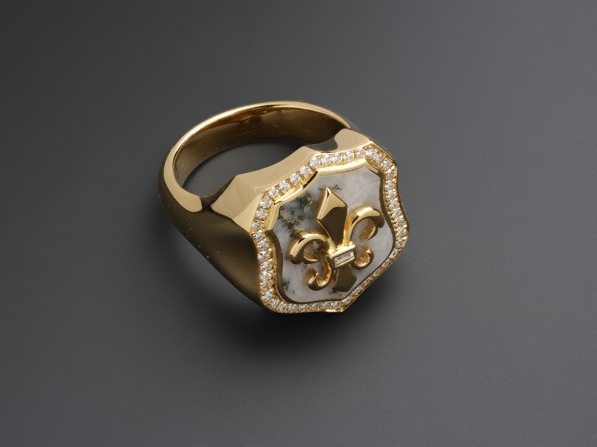 Singet ring of Scottish gold from Scotland’s first commercial gold mine (in Cononish Glen), and made by Hamilton & Inches Ltd of Edinburgh, 2019. X. 2020.22. Not only is the ring made from Scottish gold, it is set with a piece of quartz from the mine. This quartz is the host rock for the gold, deep under the mountain Beinn Chùirn in Loch Lomond and the Trossachs National Park. 