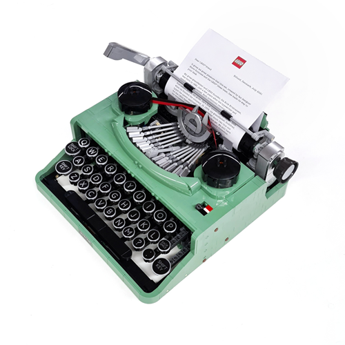 Green mechanical typewriter with round black keys