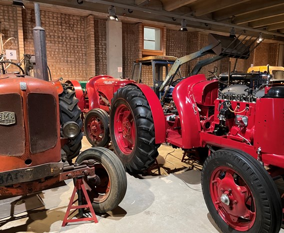 Two red tractors in a store at the National Museum of Rural Life. 