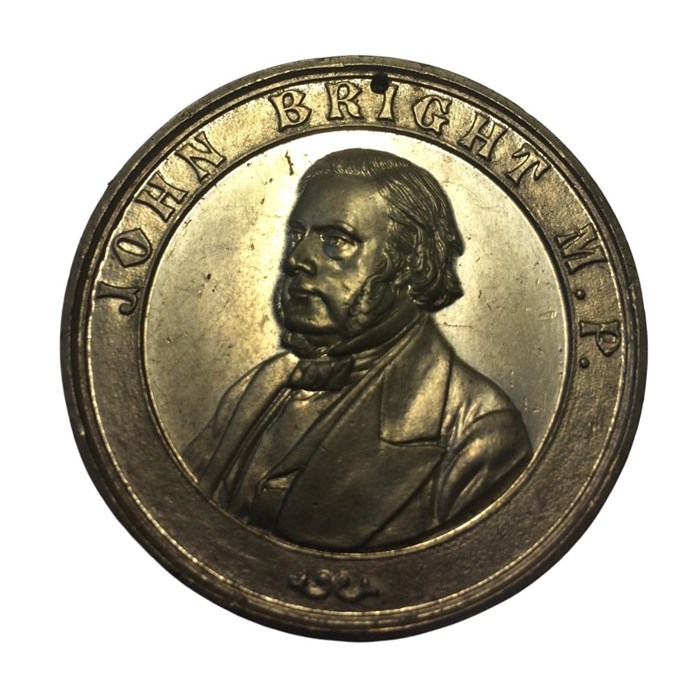 Circular bronze medal with a chest-up portrait of a man in a suit with 'mutton chop' facial hair, inscribed 'John Bright M.P.'