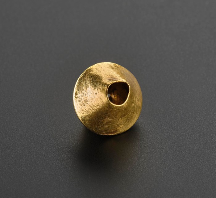 The Adabrock gold bead, hole view.