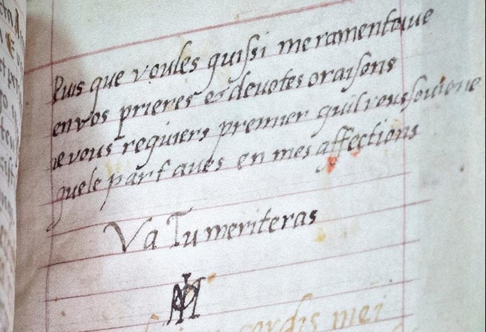 Closeup of a lined page with a four-line verse elegantly written in French with black ink by Mary.