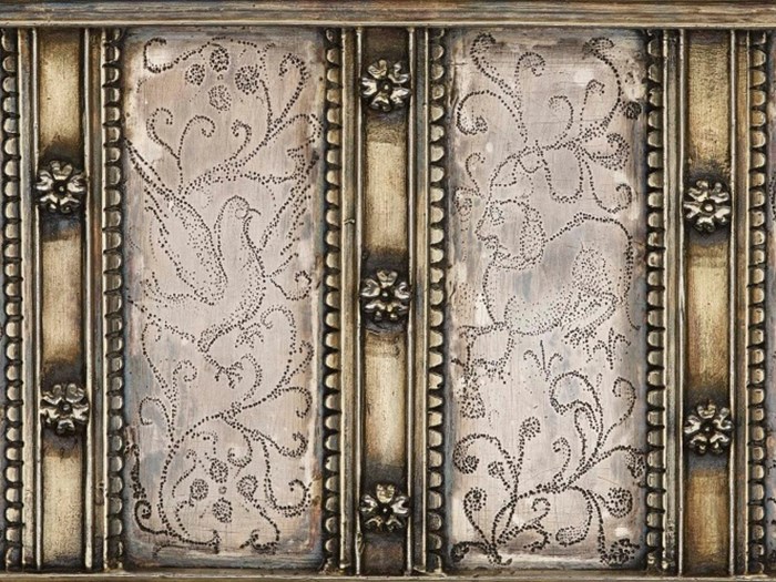 Closeup of pin-pricked designs on the casket's side. © National Museums Scotland
