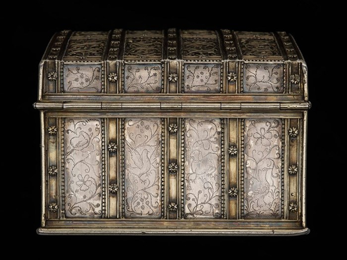 Pin-pricked designs on the casket's side. © National Museums Scotland