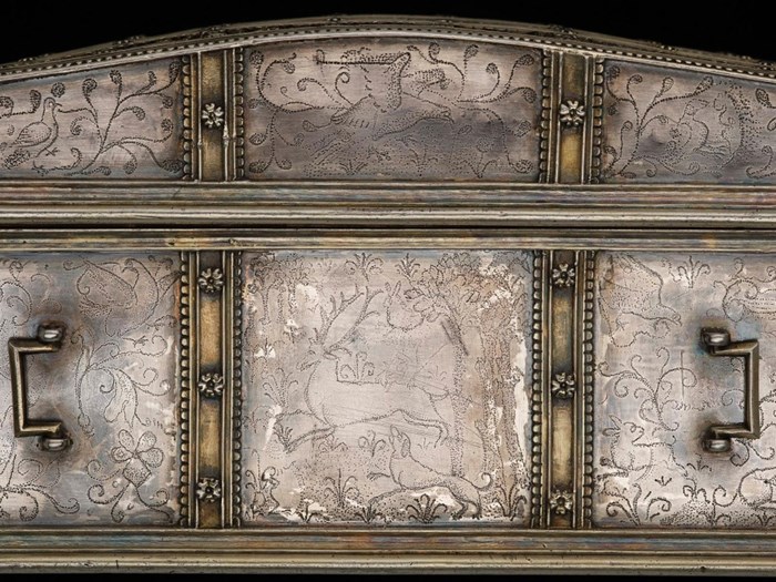 A stag and hound form one of the scenes across the casket's surface. © National Museums Scotland