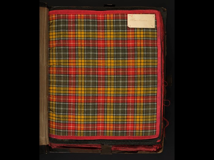A sample of Buchanan clan tartan, from a bound collection of 58 clan setts dating from the early 19th century. Each sample in the volume is edged with silk and meticulously labelled, suggesting it once belonged to a textile merchant or manufacturer (H.TTB 11)