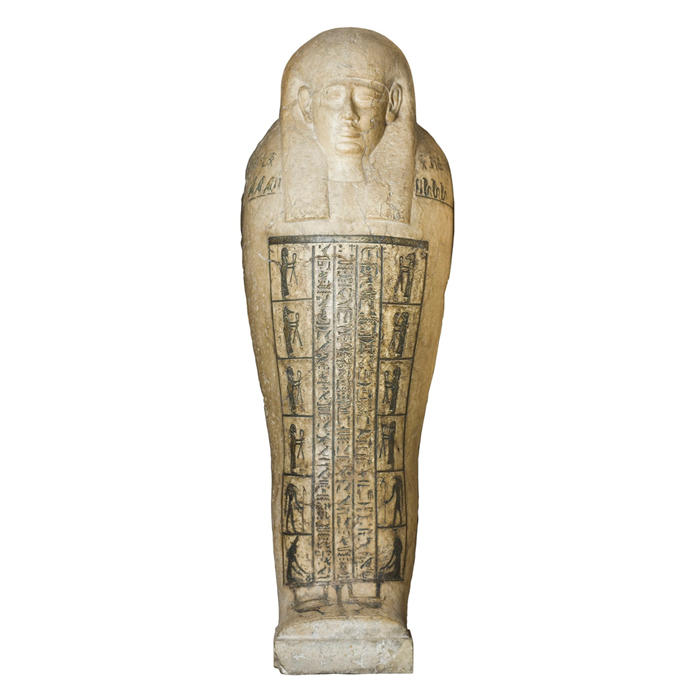 Egyptian figurine of a sarcophagus upright and facing forward. Hieroglyphs and figures are drawn across the front. Plain white background.
