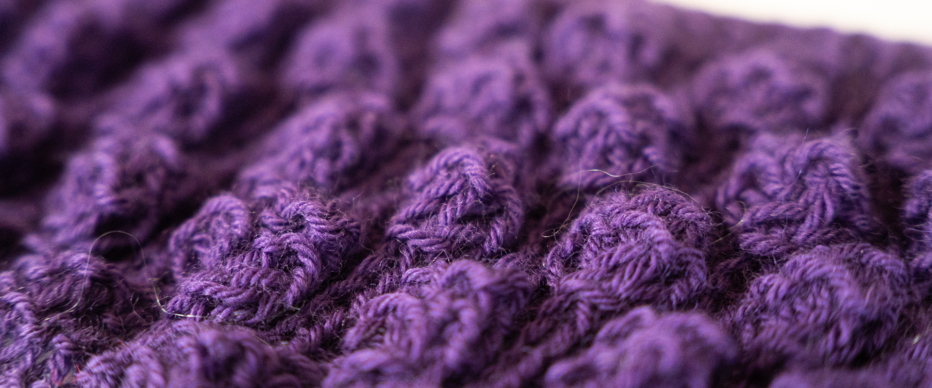 This purple sample was made by Veronica Leach, a volunteer knitter part of the Fleece to Fashion project.
