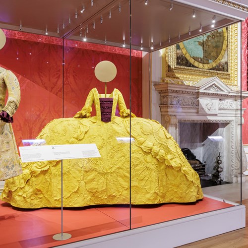 The yellow mantua on display in the Crown and Couture exhibition at Kensington Palace © Historic Royal Palaces