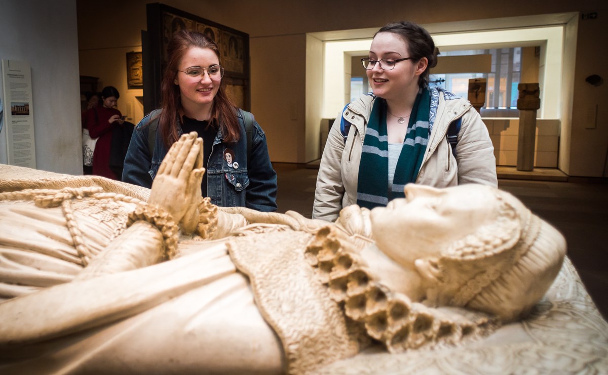 Two visitors look on at the Replica of the tomb of Mary, Queen of Scots.