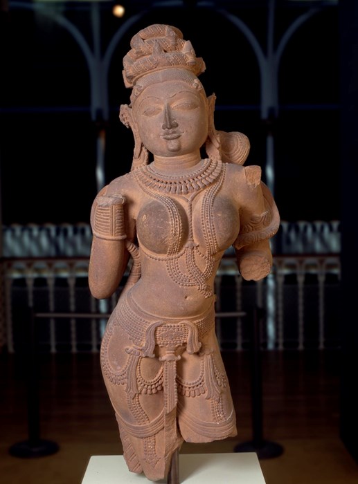 Figure of a Surasundari or divine beauty, wearing elaborate jewellery and with dressed hair, carved sandstone.