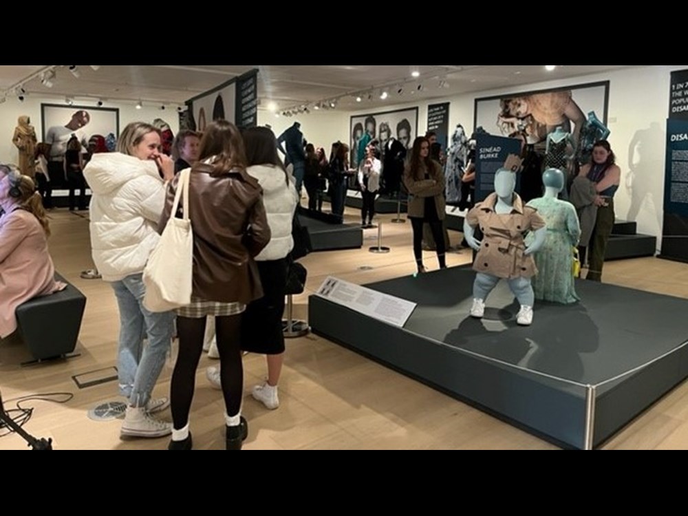 A group of people visit the exhibition.