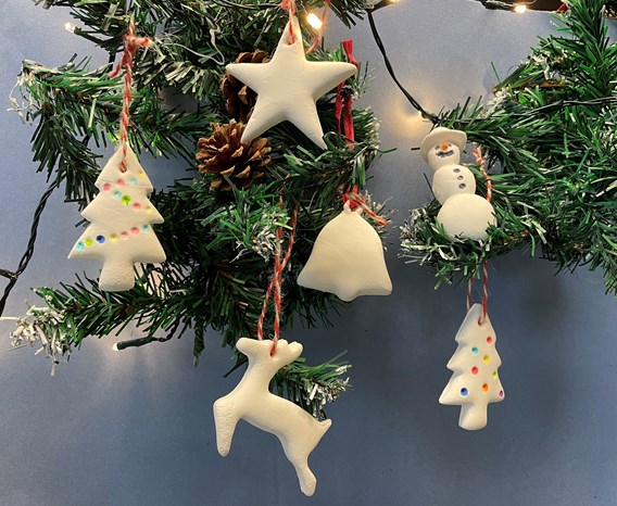 A group of ornaments on a Christmas tree.