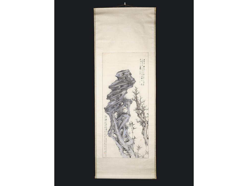 A Korean scroll painting of a rock, bamboo and plum blossom.