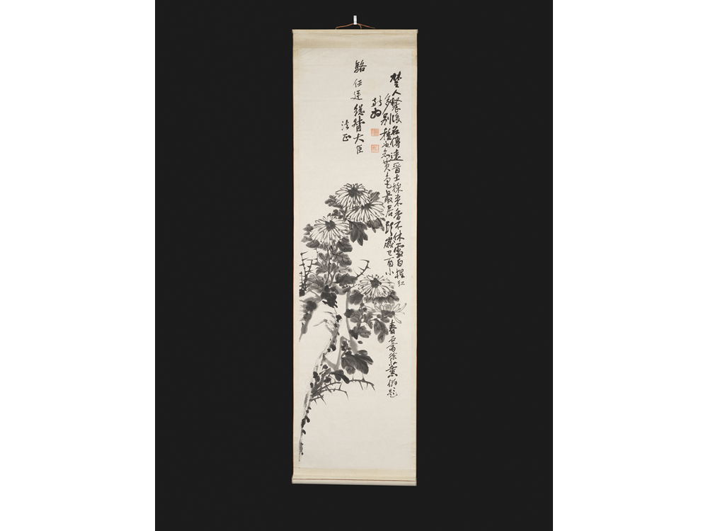 A hanging scroll painting, depicting a rock and chrysanthemums.