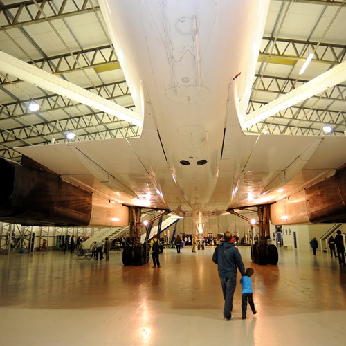 View of the underside of the Concorde inside an aircraft hangar