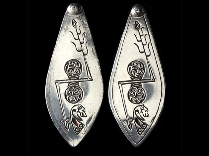 Leaf-shaped plaques of silver bearing two Pictish symbols found on early medieval sculptured stones, from Norrie's Law, Fife. Left: 6th-7th century A; right: 19th-century copy