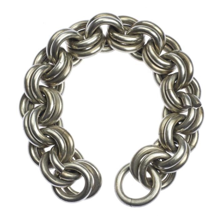 Massively thick and heavy-looking set of silver chains forming a horseshoe shape against a white background.