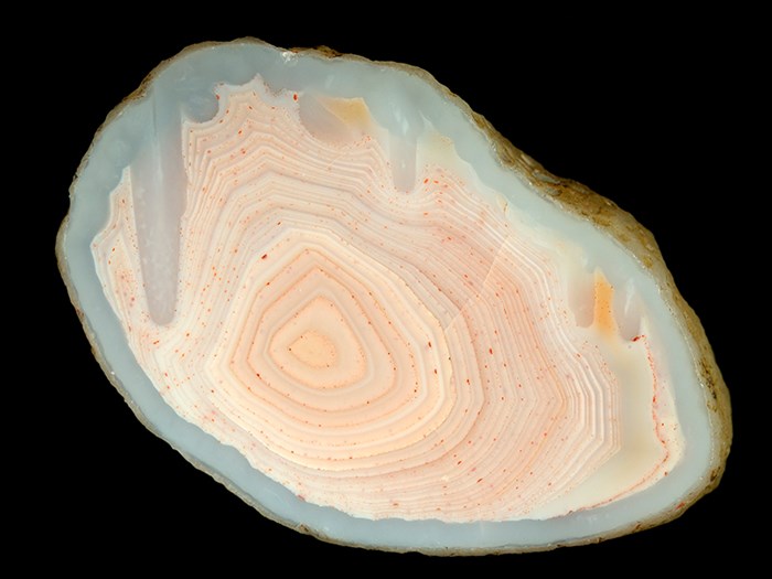 Pale pink agate from Ballindean. Note the stalactites and banding.
