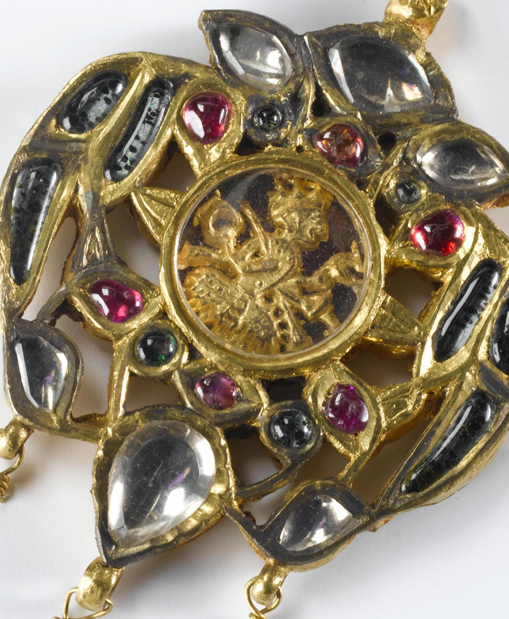 Pendant of gold with rubies and glass stones; in the centre the depiction of deity under a rock crystal: Northern India, probably Punjab, 19th century, formerly in the possession of Maharaja Duleep Singh