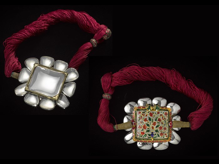 Front and rear view of armlet composed of a central rock crystal and ten smaller stones set in silver, the back decorated with Jaipur enamel on gold: Northern India, 1800-1850.