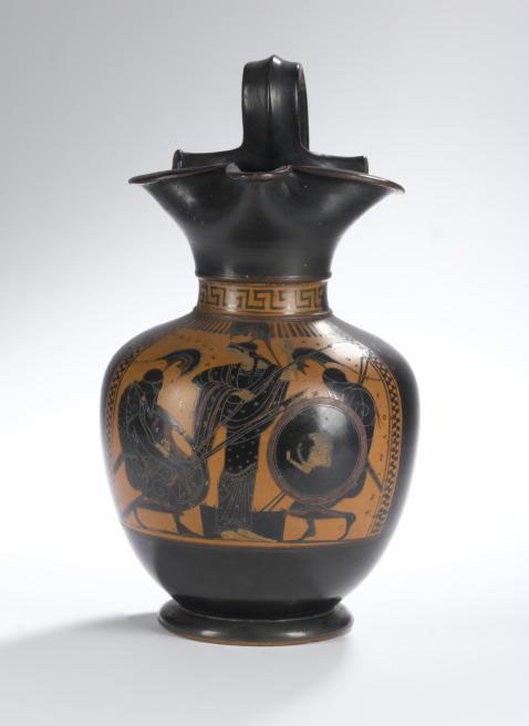 Oenochoe of pottery with black figure decoration showing Athene between Achilles and Ajax who are playing a board game.