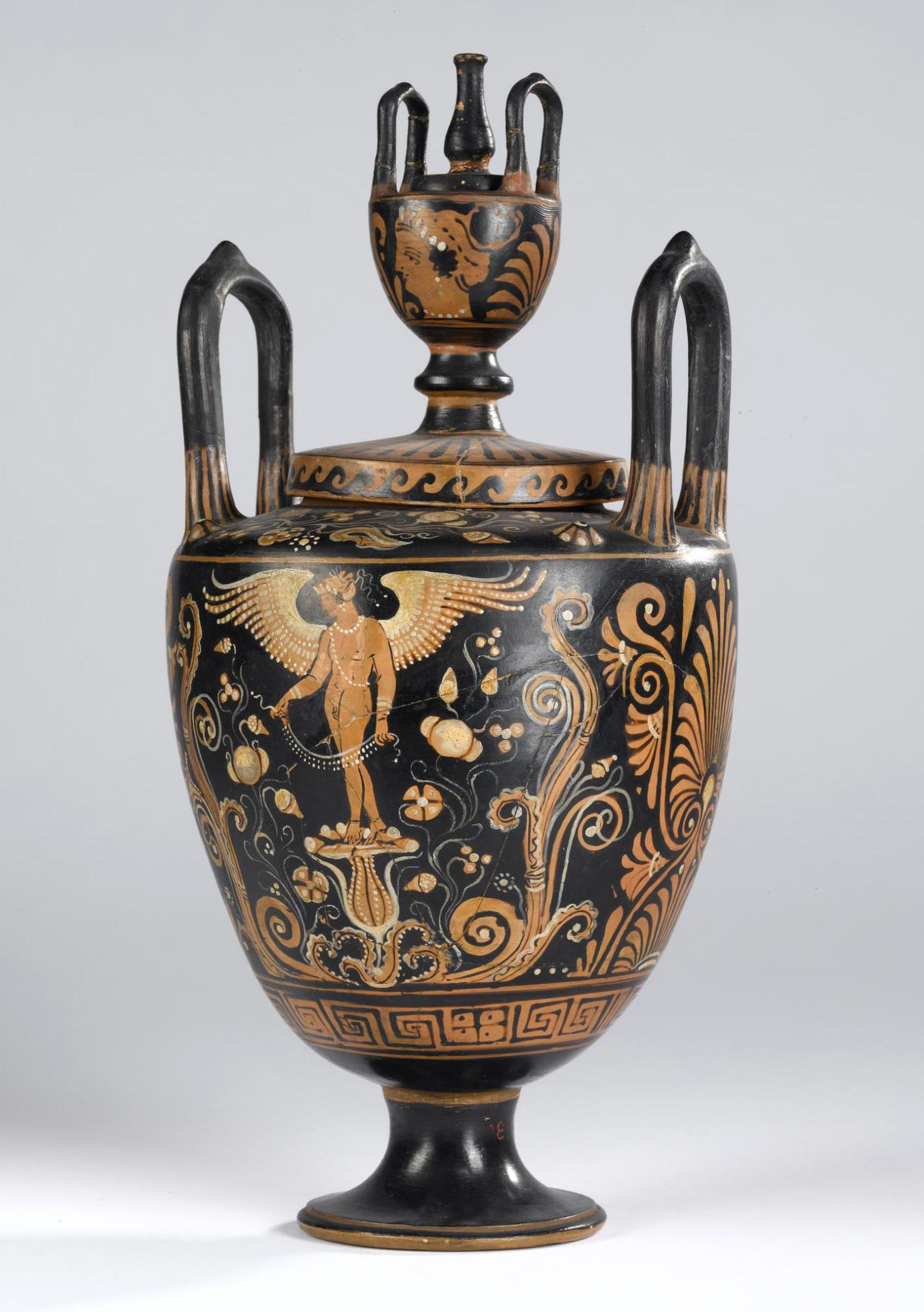Lebes gamikos of pottery decorated in red figure style with two standing figures of Eros, palmettes, key meander and scrollwork.