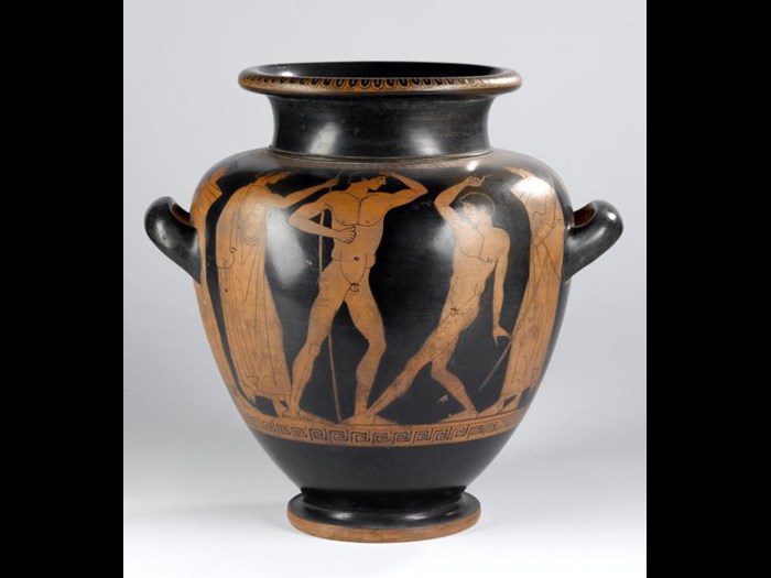 Earthenware stamnos with red figure decoration of wrestlers, boxers, and figures with staffs.