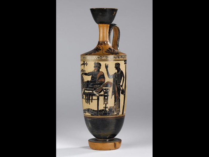 Lekythos of pottery decorated in black figure style on a white ground with a scene representing Achilles delivering up the body of Hector to Priam.