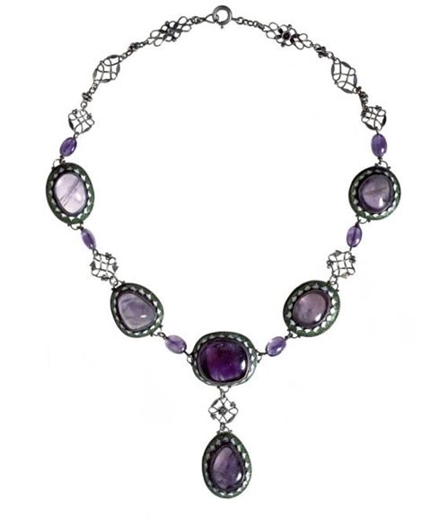 Necklace of silver, amethysts, and green and white enamel.