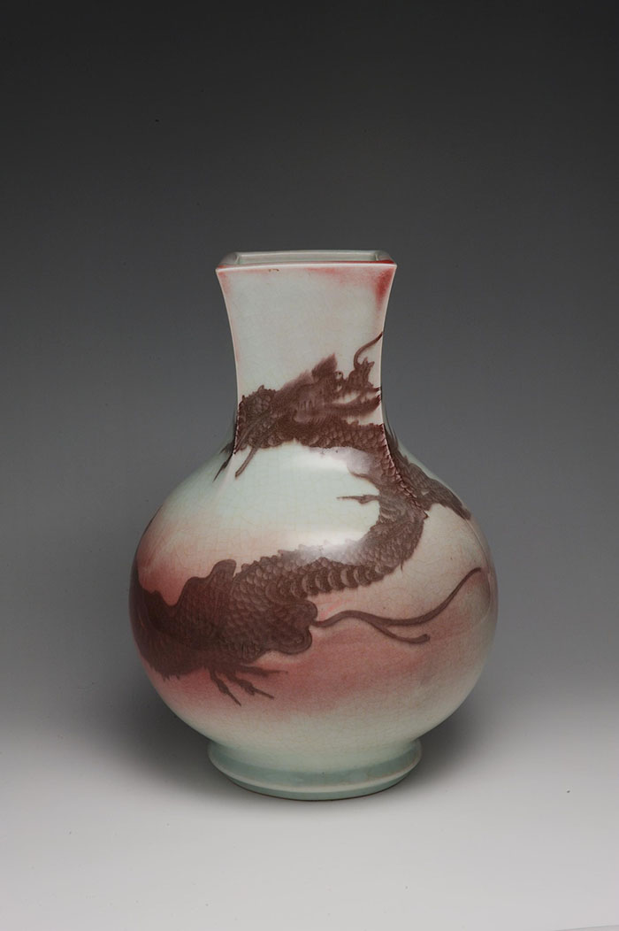 Bottle vase by Miyagawa Kozan with dragon design in underglaze copper red, c1880-90.