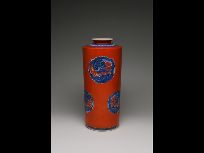 Red cylinder vase with blue dragon roundels by Seifu Yohei III. c1890. 