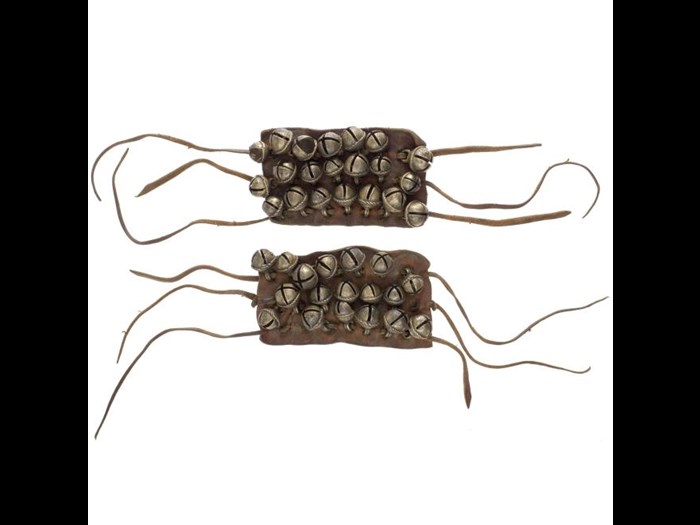 Pair of leather anklets with brass pellet bells attached, worn by dancers. India, Rajasthan, Nagaur district, mid 20th century.