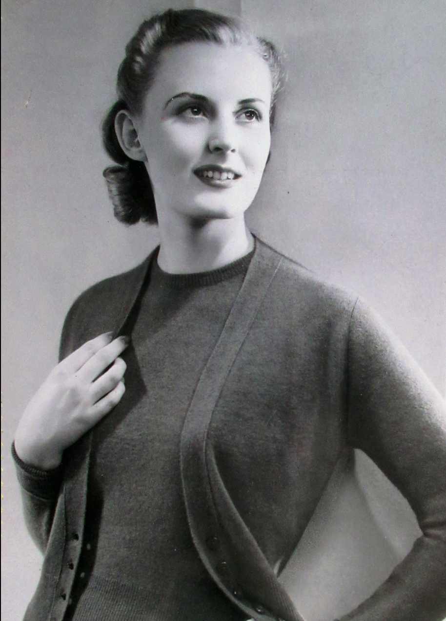 Model wearing a twinset from a Pringle catalogue, 1940s.