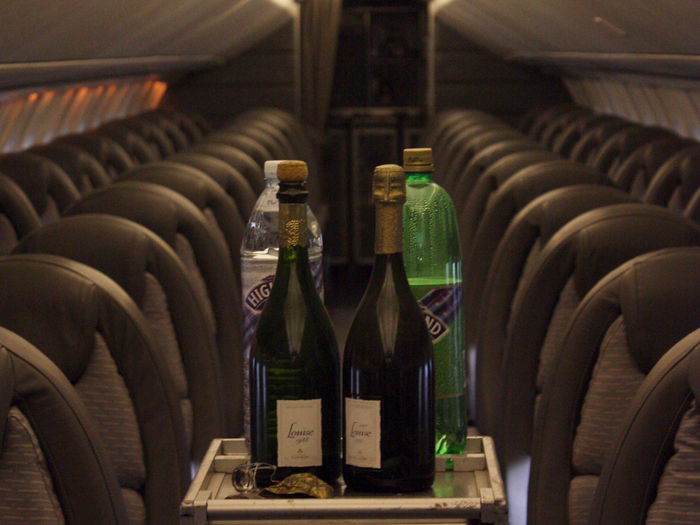 Bar cart in aisle of empty Concorde plane