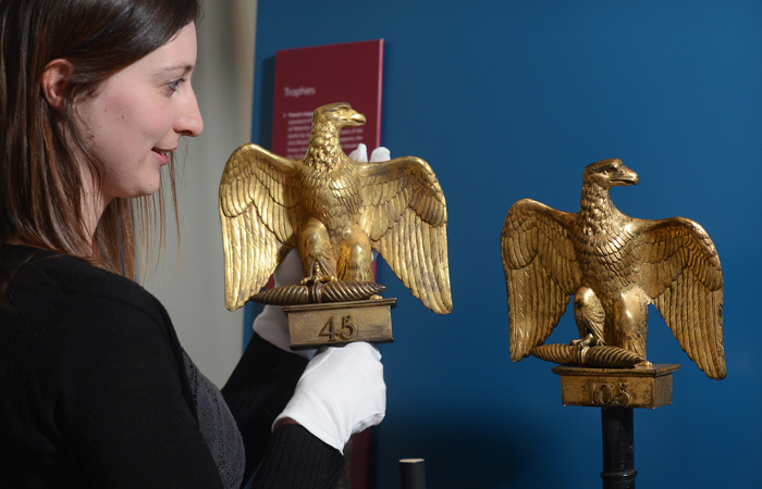 Adrienne Breingan, Assistant Curator, National Museums Scotland installing Ewart's Eagle in the display. 
