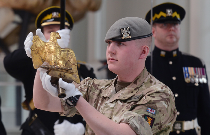 The youngest serving soldier from the Royal Scots Dragoon Guards presenting Ewart’s Eagle.