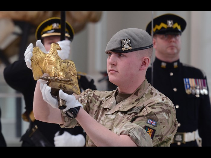 The youngest serving soldier from the Royal Scots Dragoon Guards presenting Ewart’s Eagle.